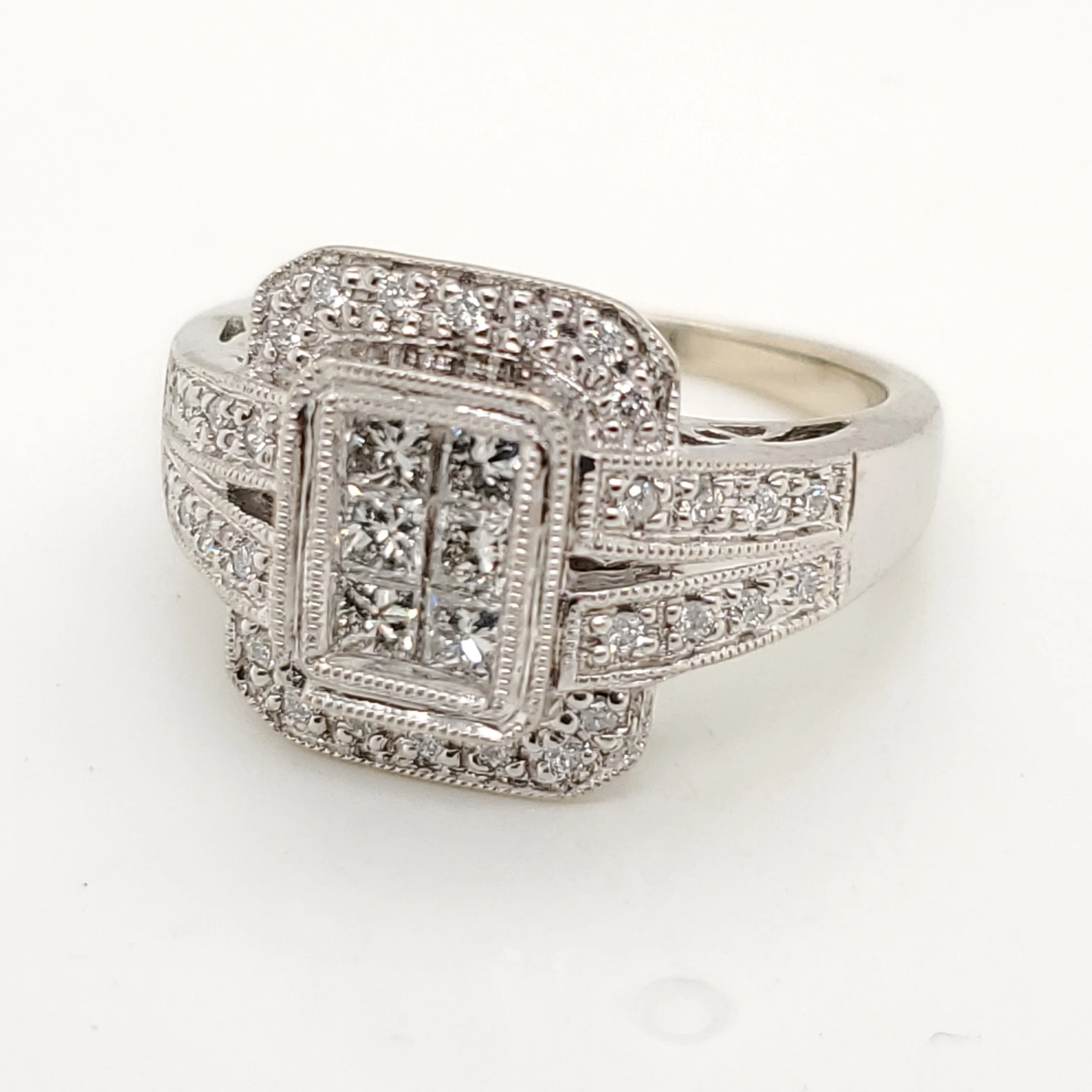 14Kt White Gold Princess And Round Brilliant Cut Diamond Ring