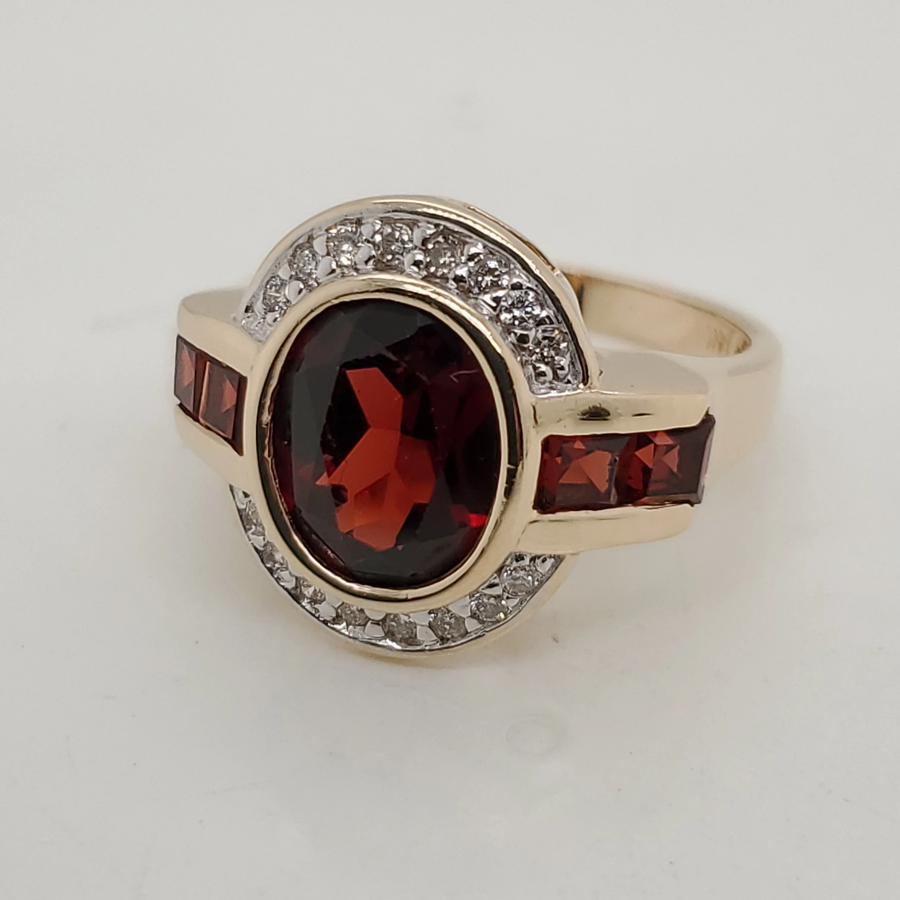 14kt Yellow Gold Oval Cut Garnet and Diamond Ring